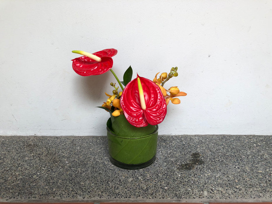 Red Anthuriums & Orange Orchids Cocktail Arrangement